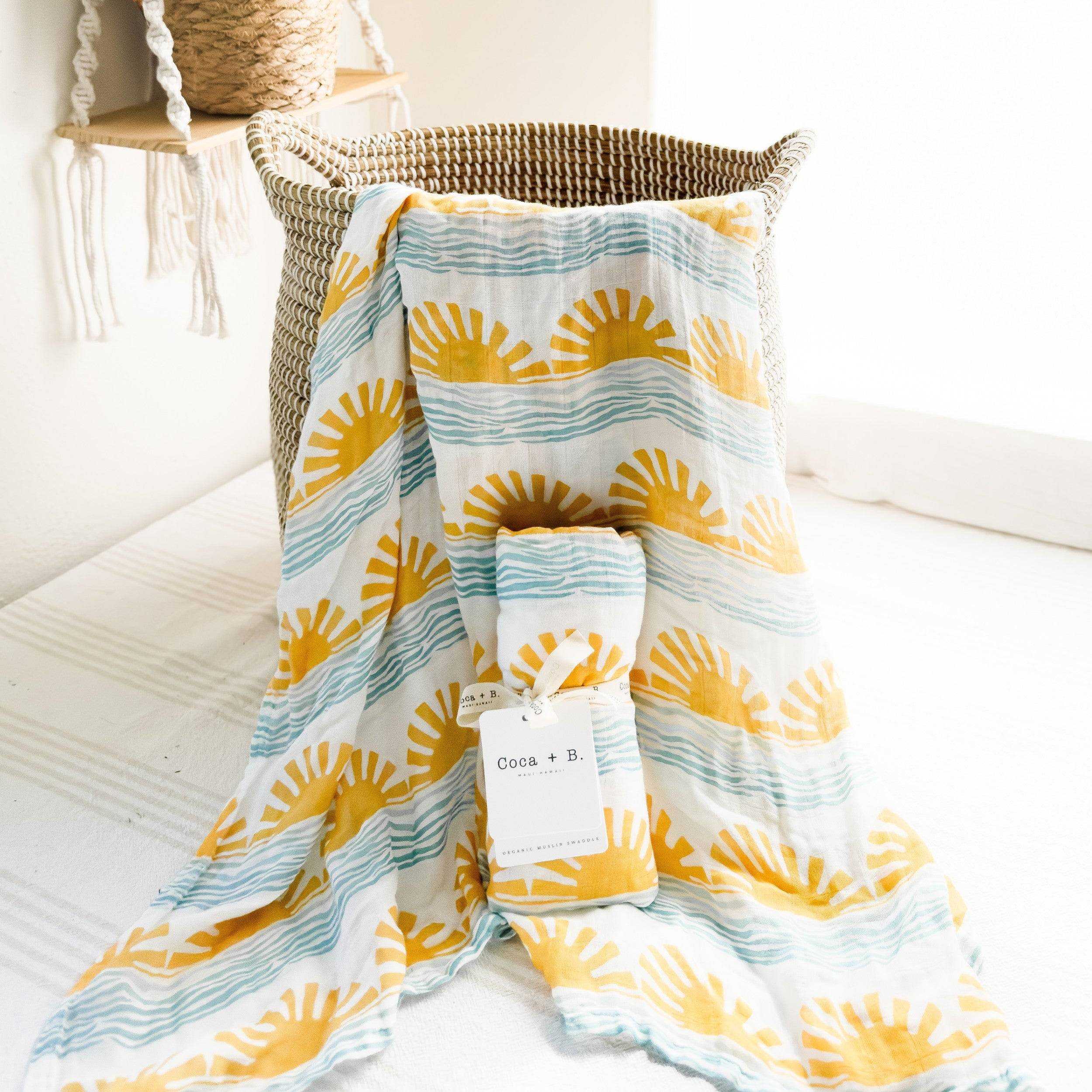 organic sun and wave surfer baby swaddle in yellow and blue