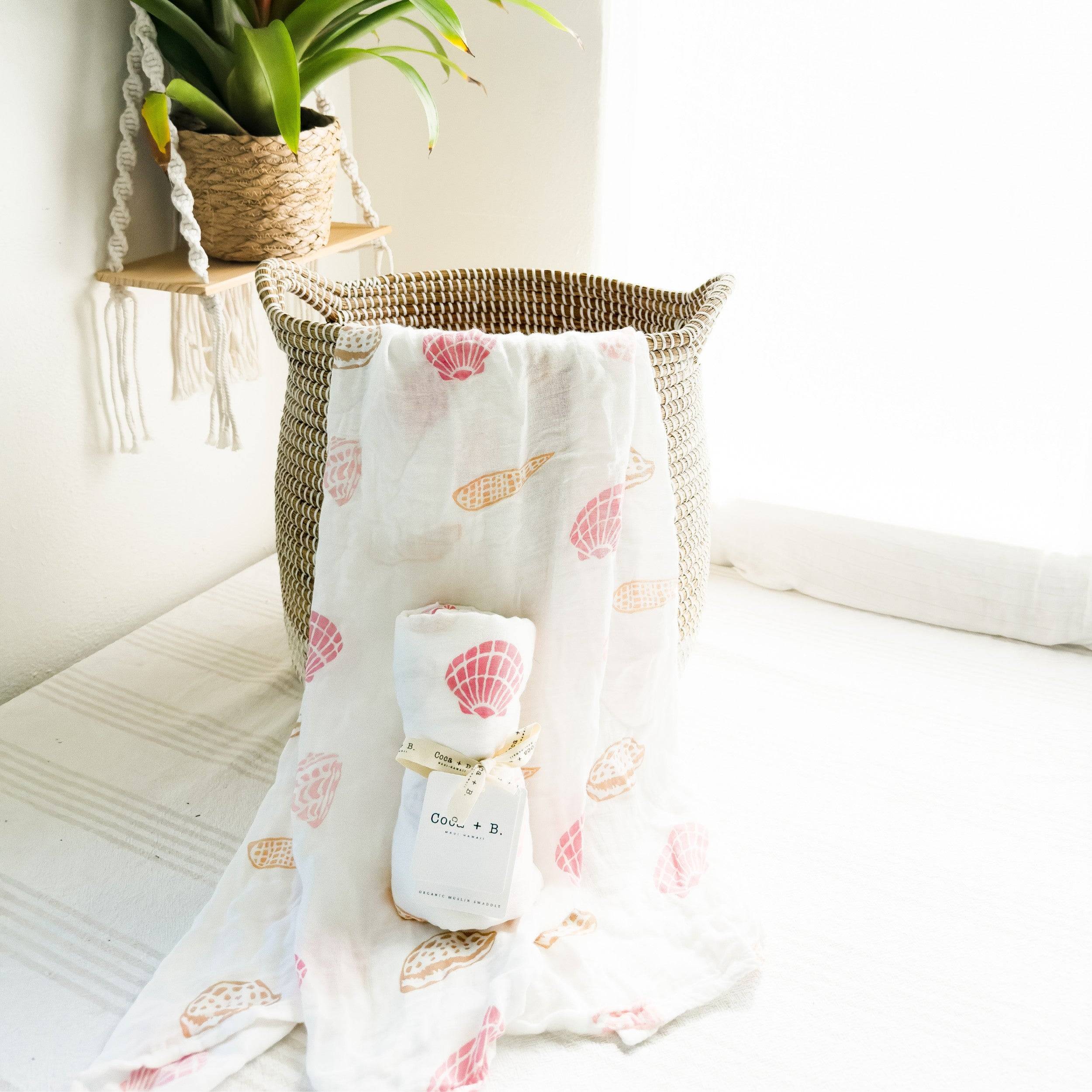 seashell printorganic baby swaddle in soft pinks and sand colors