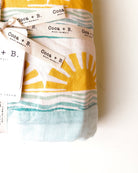 Sun + Wave Organic Muslin Throw Blanket - Coca + B.