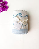 Endless Wave – Blue Trim | 6-Layer Organic Bamboo Muslin Baby Blanket - Coca + B.