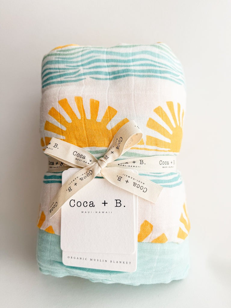 sun and wave surfer print organic cotton bamboo muslin baby blanket